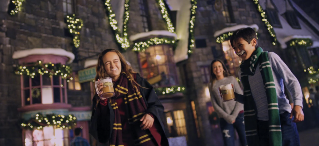 Hogsmeade in the Wizarding World of Harry Potter drinking butterbeer