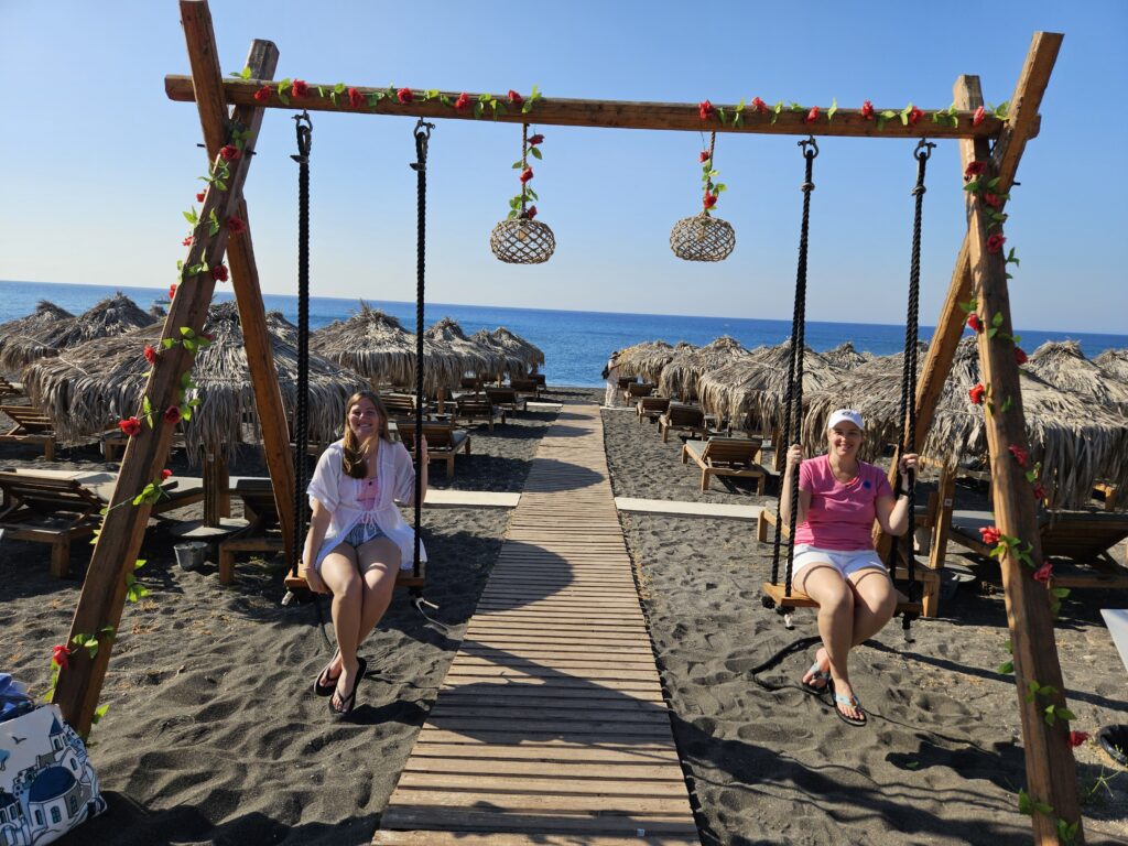 Kelly's Beach Bar swings by beach in Santorini, Greece